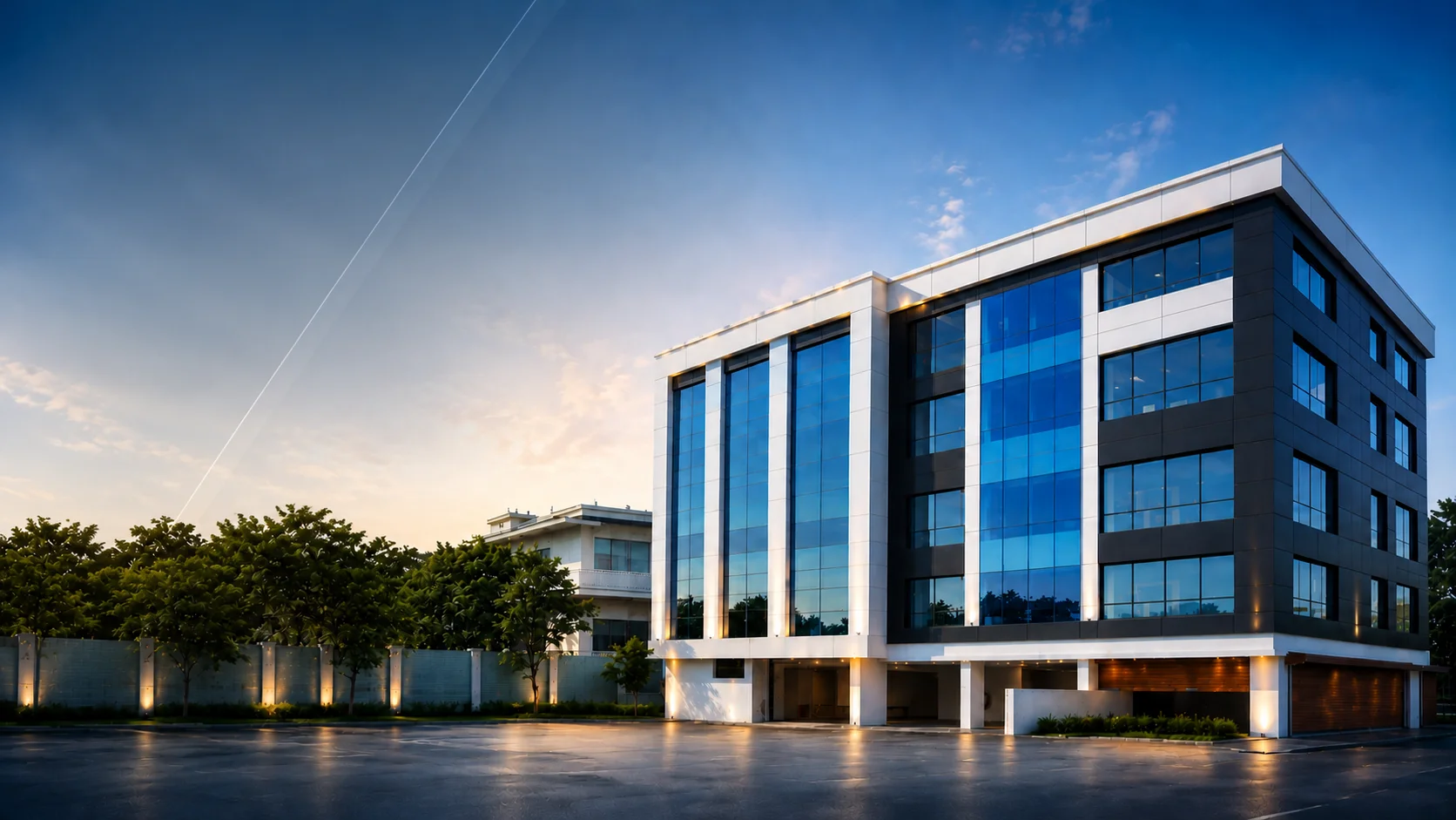Modern commercial building elevation featuring ACP cladding and structural glass glazing work by Galaxy Graphics & LED.